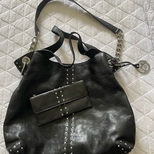 Michael Kors black with silver buds with matching wallet. Sold together.